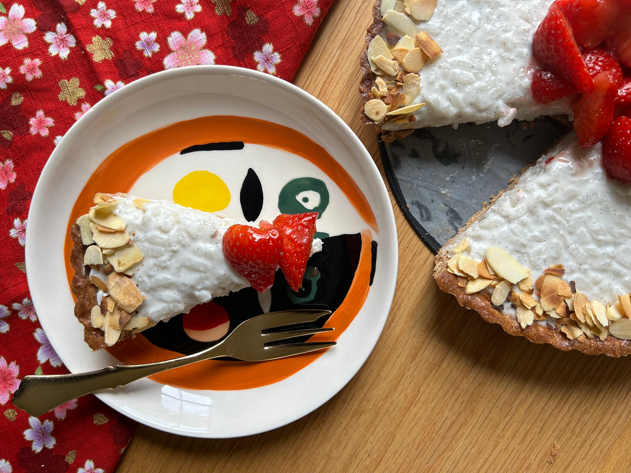 Rice pudding tart with macerated strawberries and toasted almonds